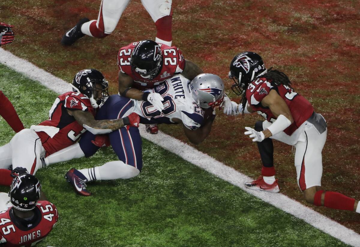 In this Feb. 5, 2017, file photo, New England Patriots' James White scores the winning touchdow ...