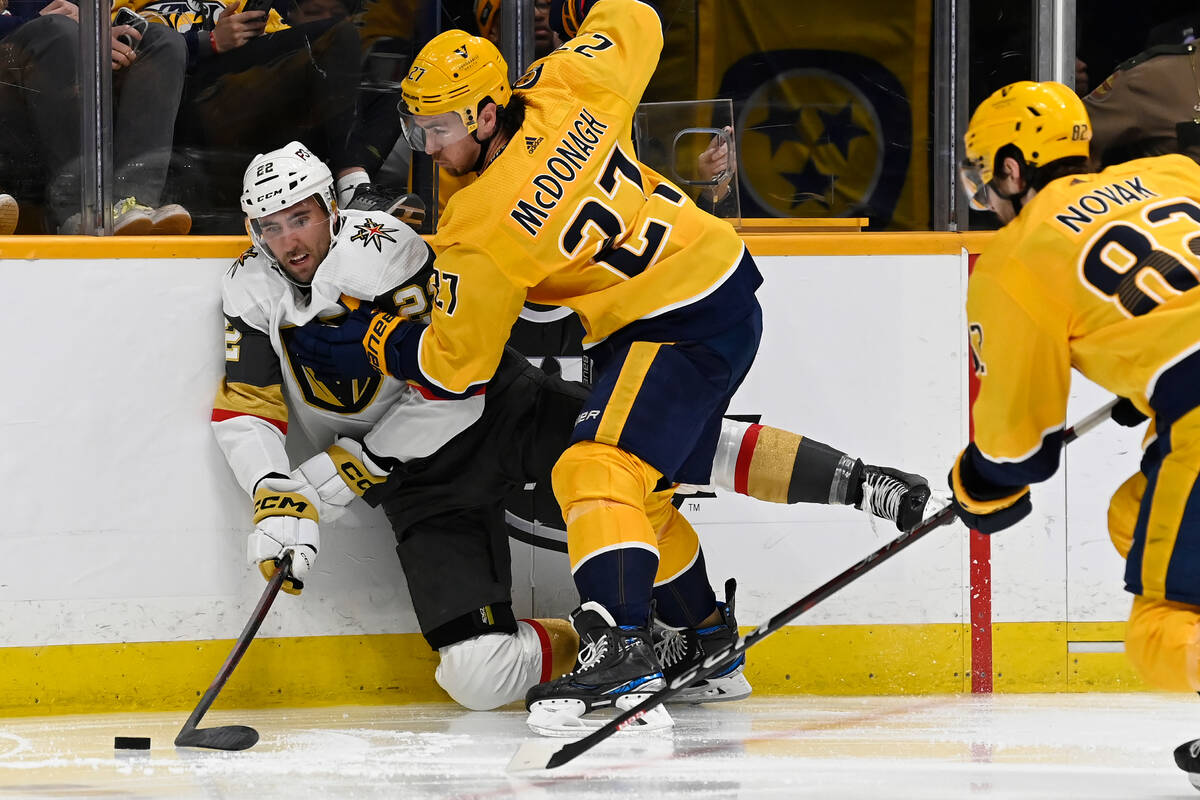 Vegas Golden Knights right wing Michael Amadio (22) reaches for the puck as Nashville Predators ...