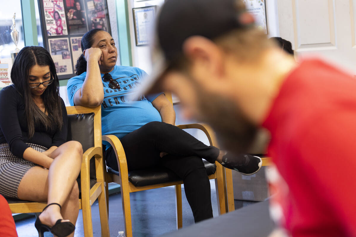 Navia Gonzalez, right, with her daughter Samantha Smith, look on as friends speak on the death ...