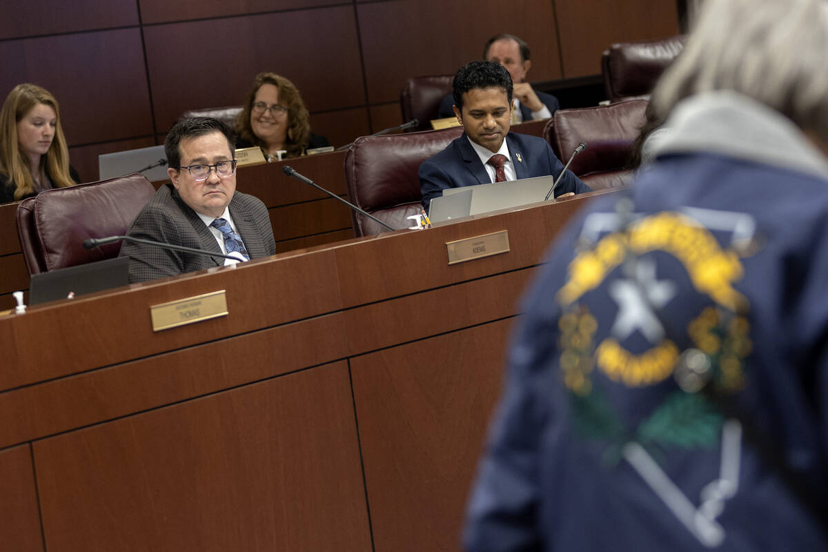 A meeting attendee wears a Battle Born Nevada jacket during the Assembly Committee on Education ...