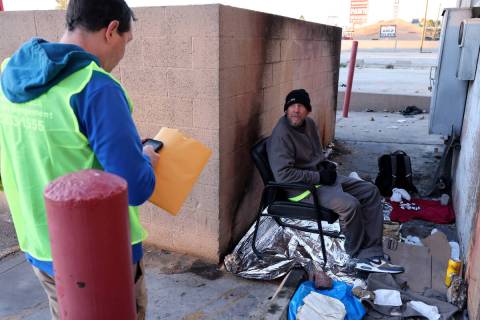 Jason Lilly, homeless services coordinator with the City of North Las Vegas, conducts a survey ...