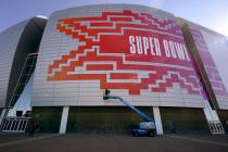 Workers prepare for the NFL Super Bowl LVII outside State Farm Stadium, Wednesday, Feb. 1, 2023 ...