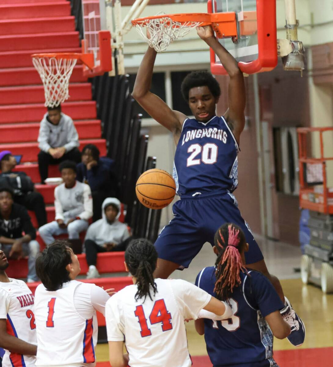 Legacy's Charles Riley (20) dunks the ball during the second half a basketball game at Valley H ...