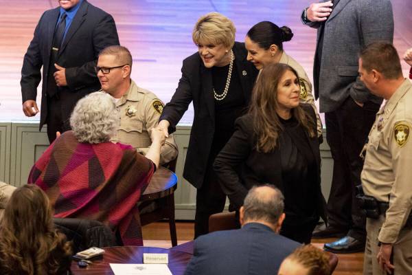 Mayor Carolyn Goodman, center, is greeted at her arrival to the Metropolitan Police Department ...