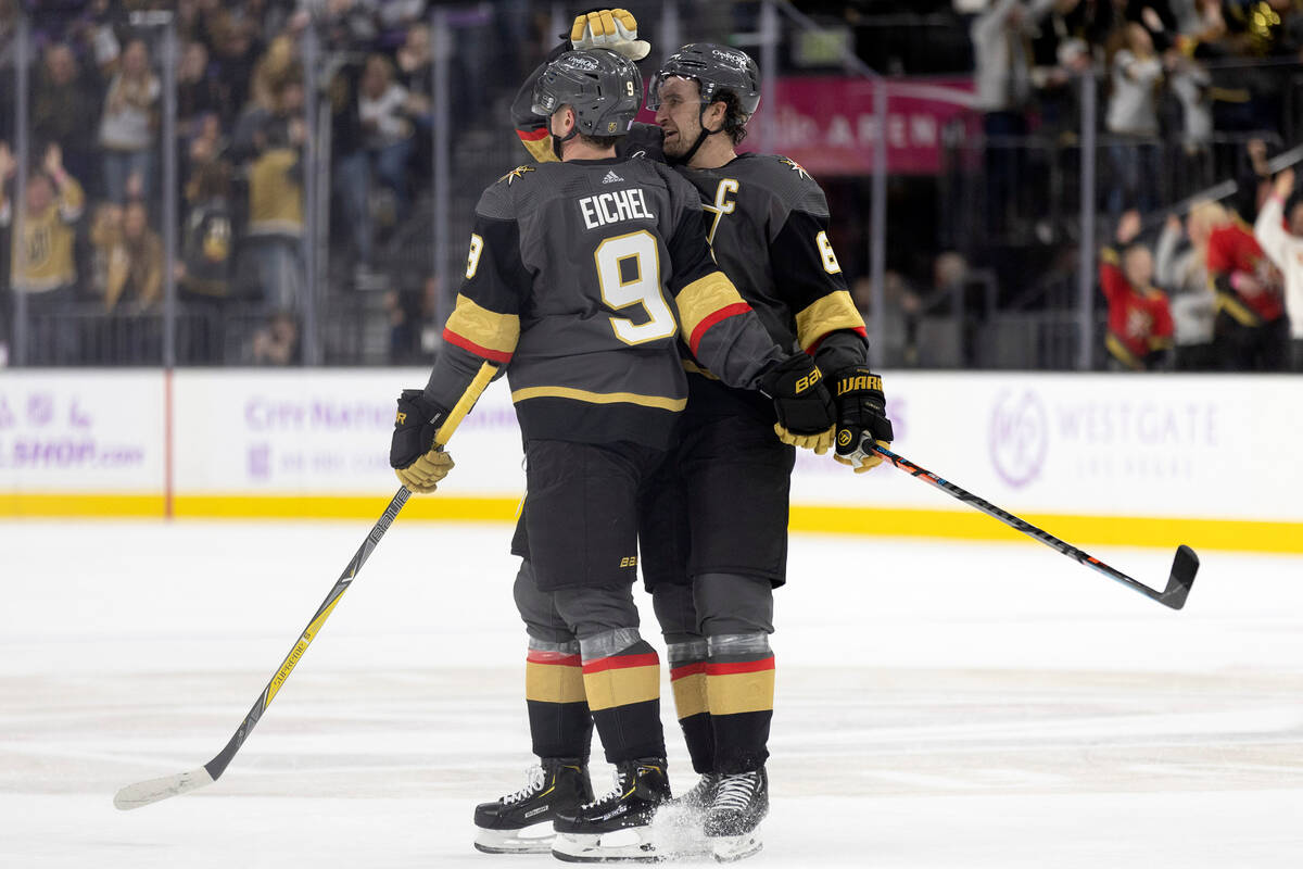 Golden Knights right wing Mark Stone (61) congratulates center Jack Eichel (9) on his goal duri ...