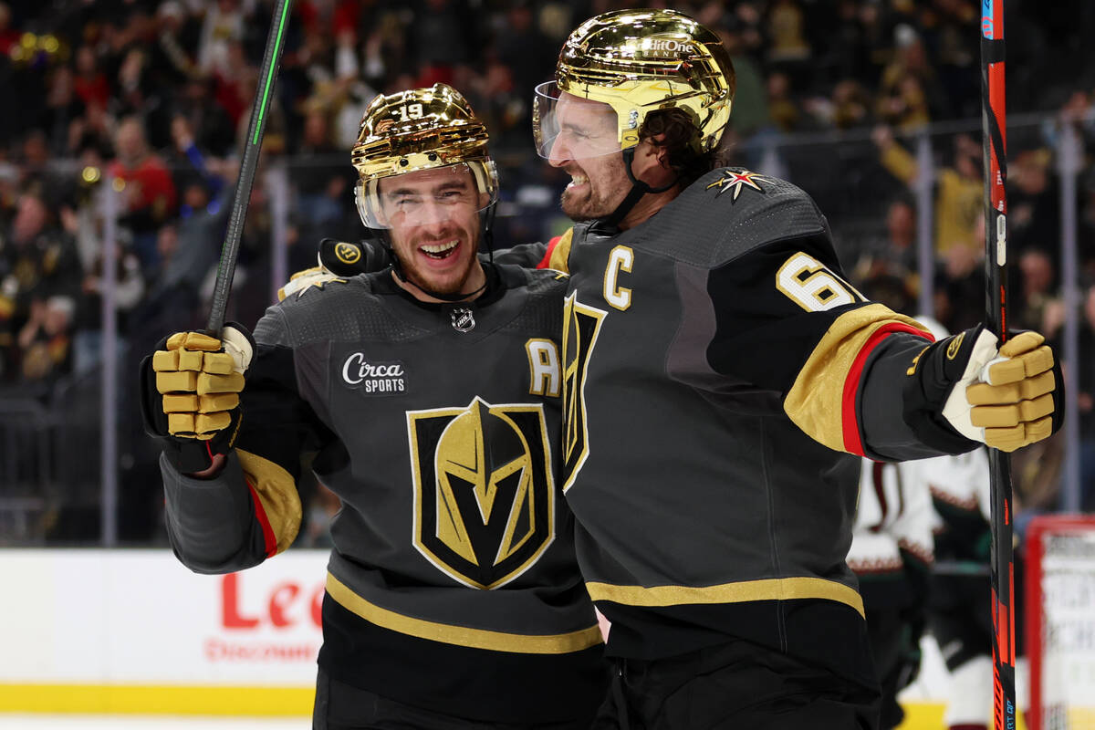 Vegas Golden Knights right wing Mark Stone (61) celebrates his goal with right wing Reilly Smit ...