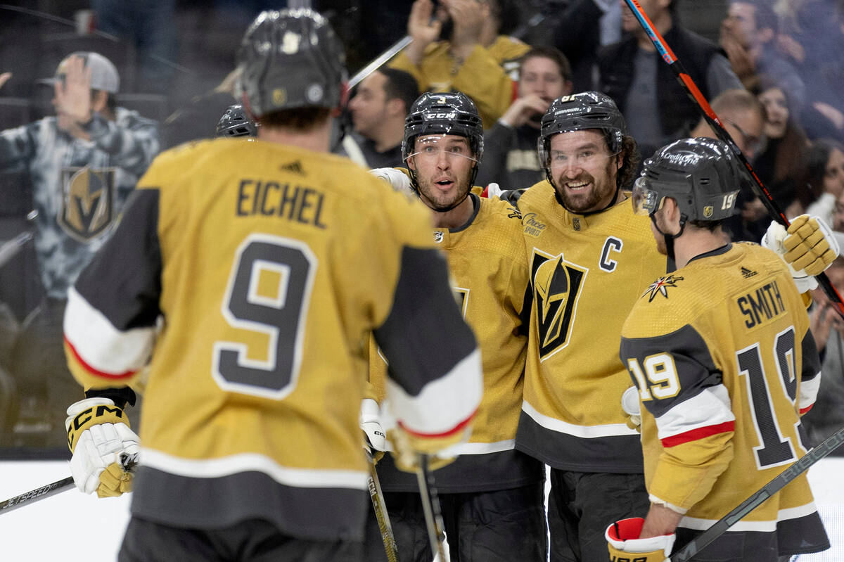Vegas Golden Knights right wing Mark Stone, second from right, celebrates his goal with center ...
