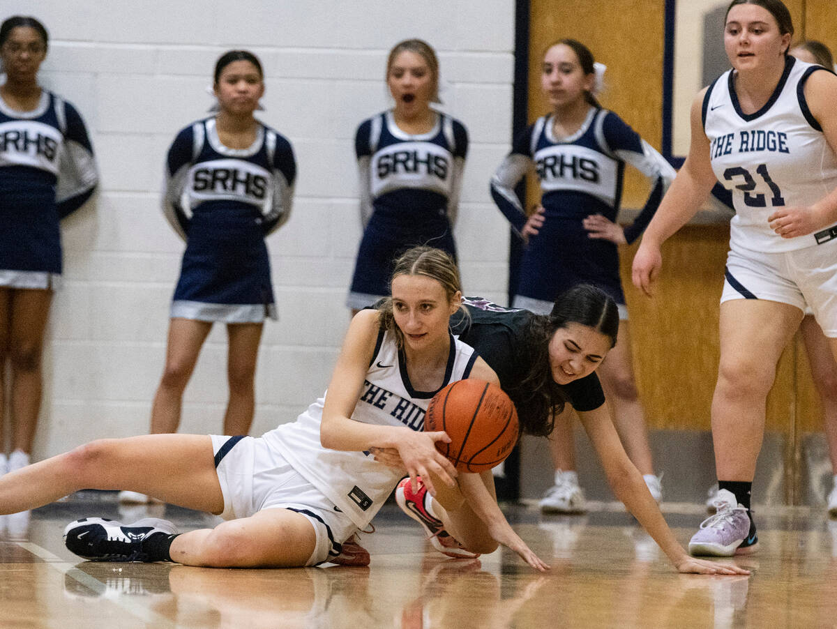 Shadow Ridge's Kelly Megown (4) and Faith Lutheran's Emma Herpin (33) fight for the loose ball ...