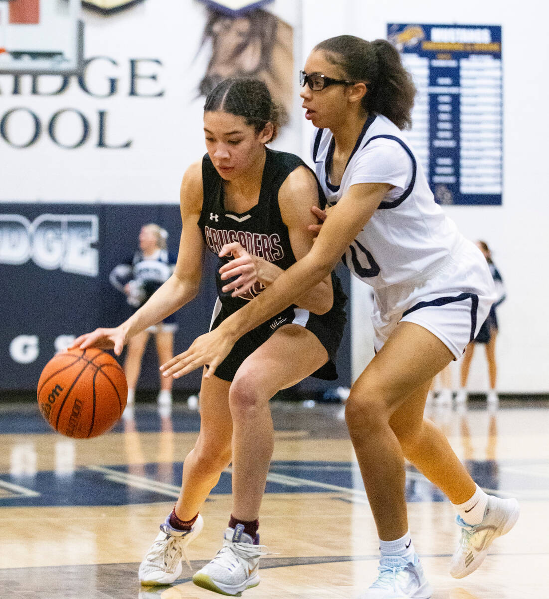 Shadow Ridge's Jaslyn Jefferson (10) defends Faith Lutheran's Leah Mitchell (34) during the sec ...