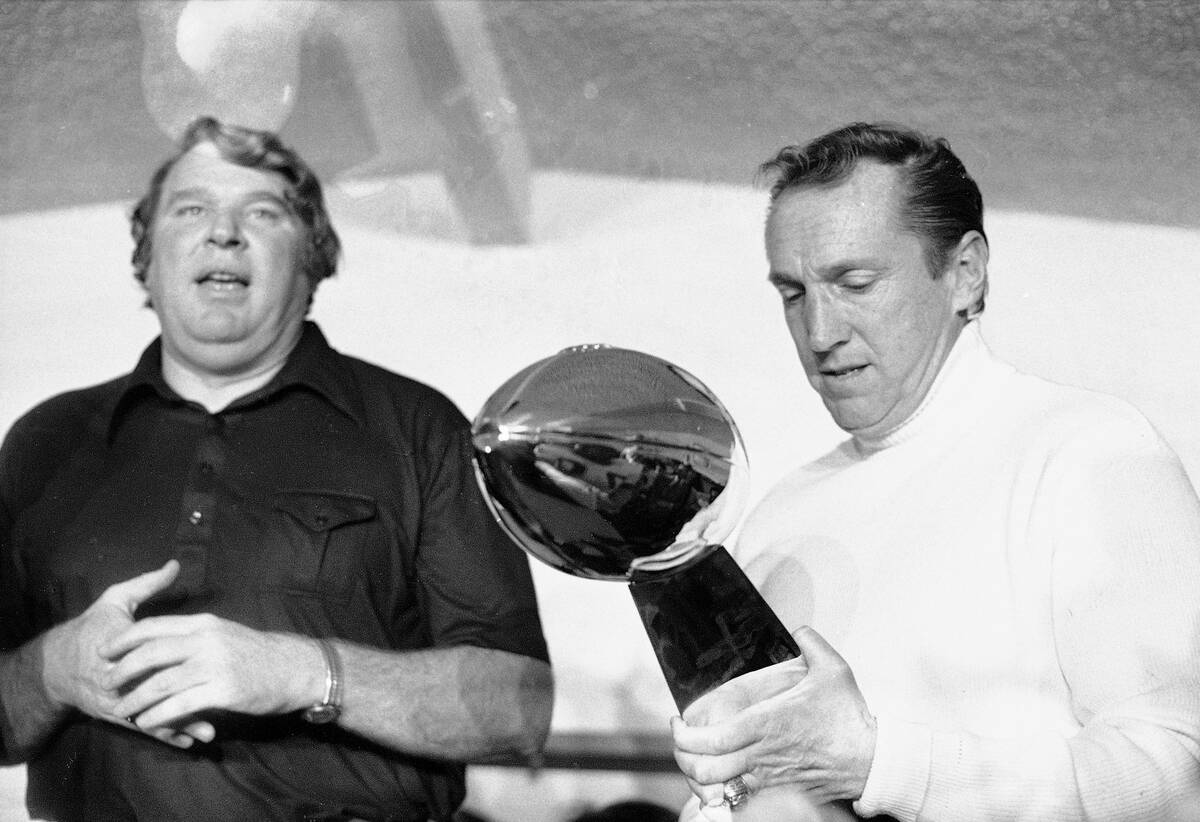 FILE - Oakland Raiders coach John Madden, left, and team owner Al Davis, holding the NFL footba ...