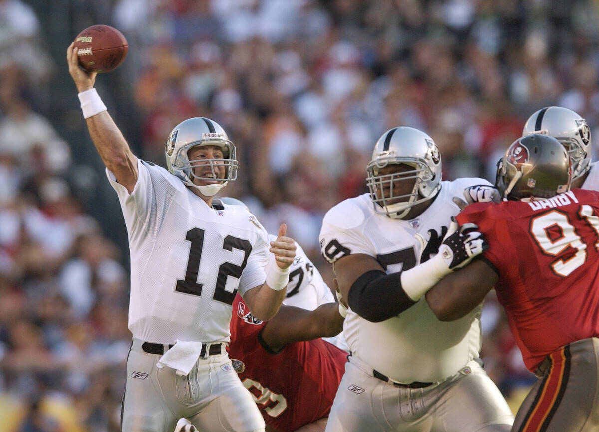 FILE - In this Jan. 26, 2003, file photo, Oakland Raiders quarterback Rich Gannon (12) passes i ...