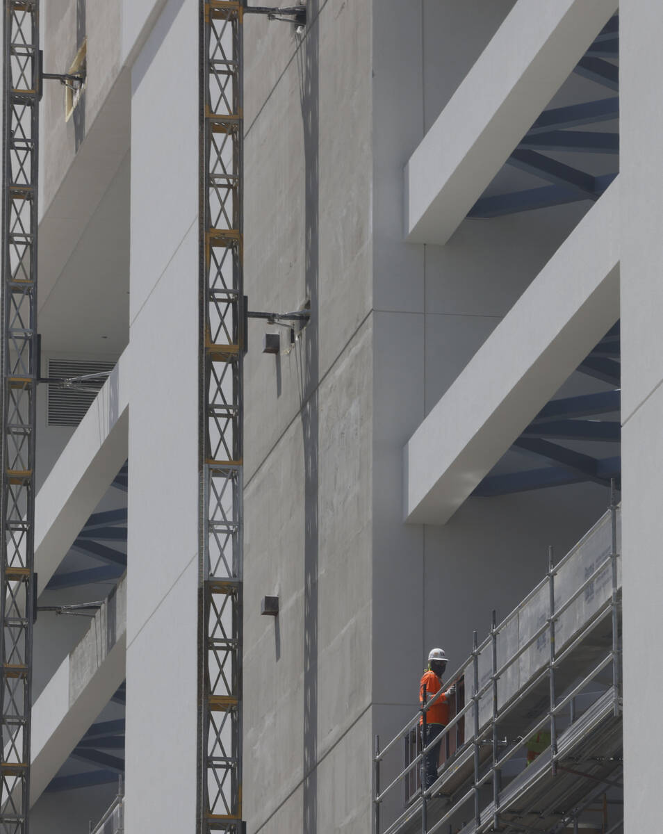 A worker performs a task at a construction site of Fontainebleau Las Vegas , Friday, May 20, 20 ...
