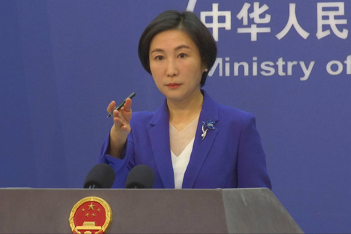 FILE - Chinese Foreign Ministry spokesperson Mao Ning gestures during a press conference at the ...