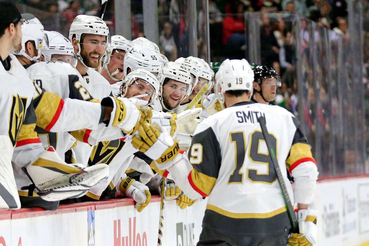 Vegas Golden Knights Reilly Smith (19) is congratulated by teammates after scoring a goal on a ...