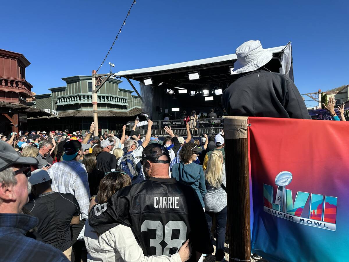 Fans watch a live broadcast of NFL Live at the ESPN Main Street Tailgate in Scottsdale, Arizona ...