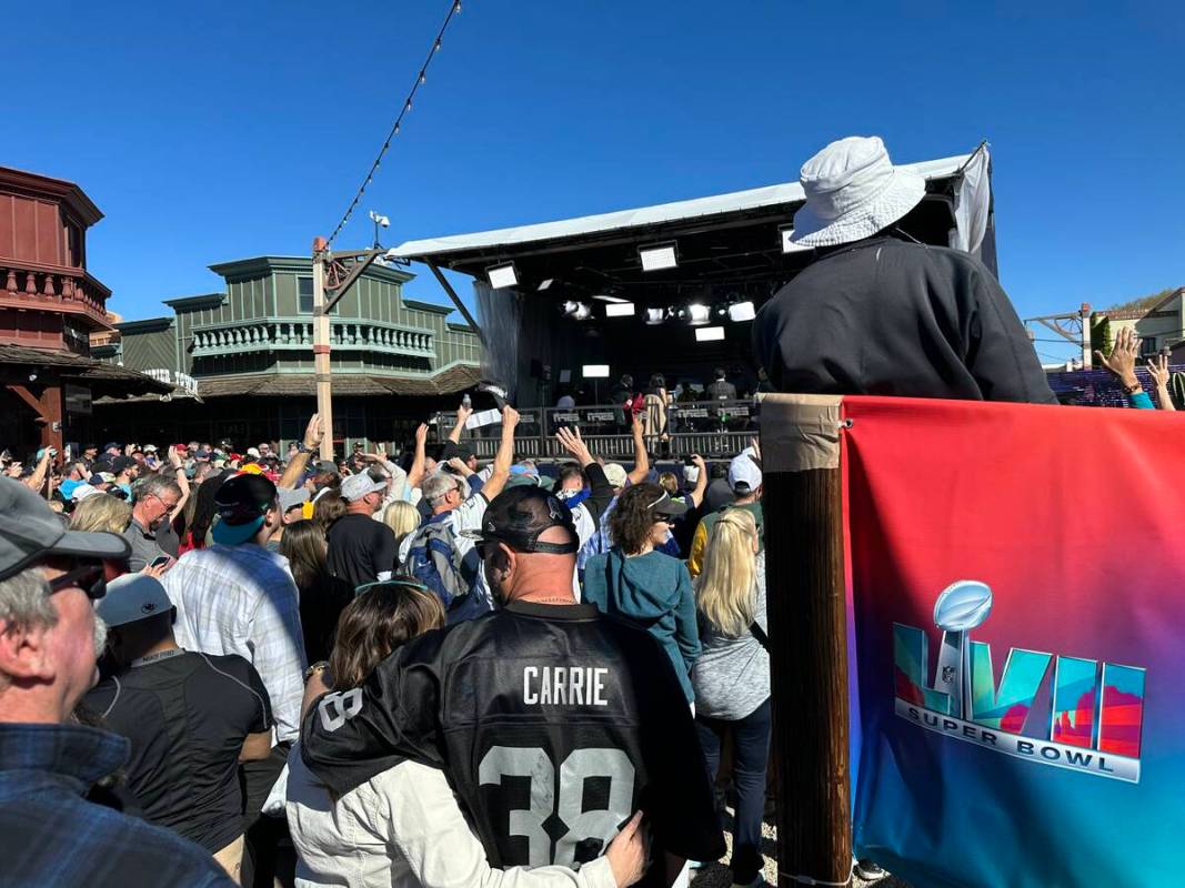 Fans watch a live broadcast of NFL Live at the ESPN Main Street Tailgate in Scottsdale, Arizona ...