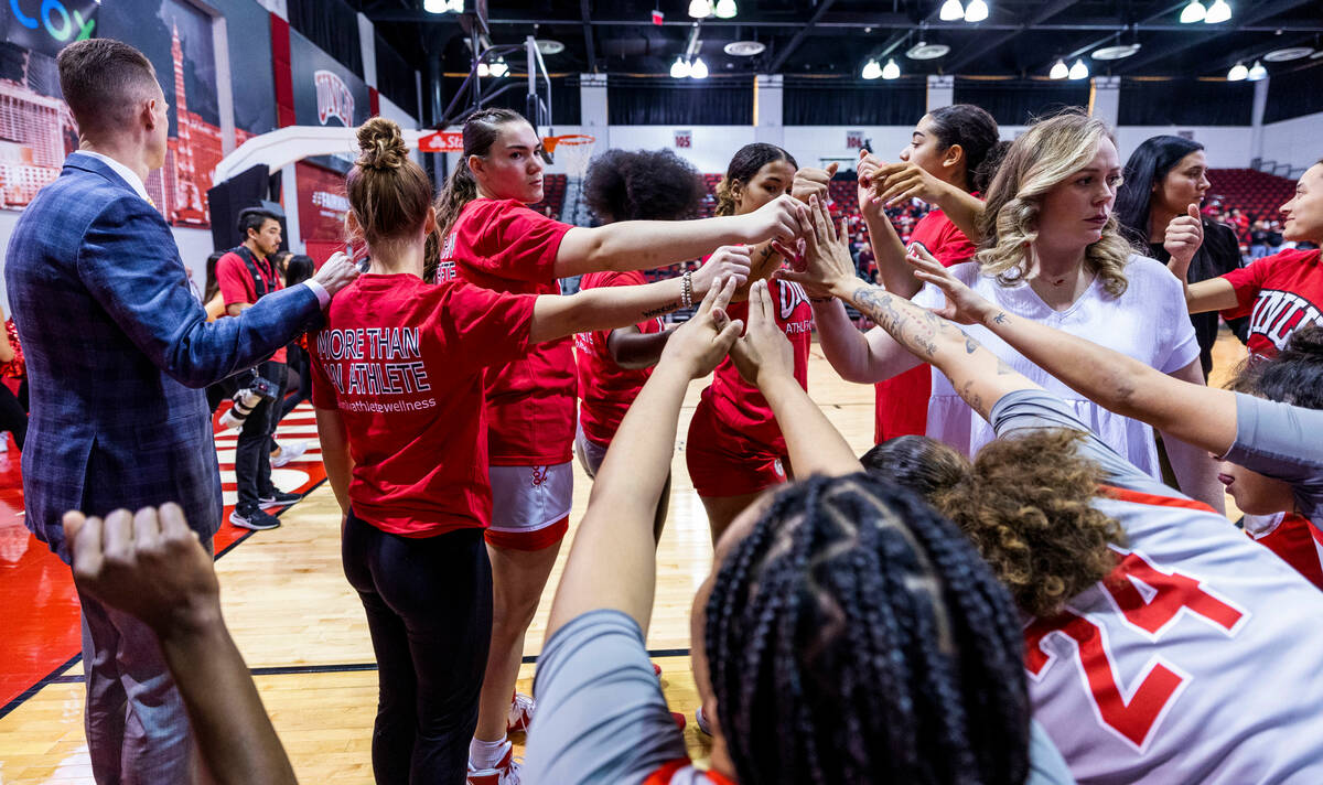 UNLV Lady Rebels head coach Lindy La Rocque, right, and players come out of a huddle against th ...