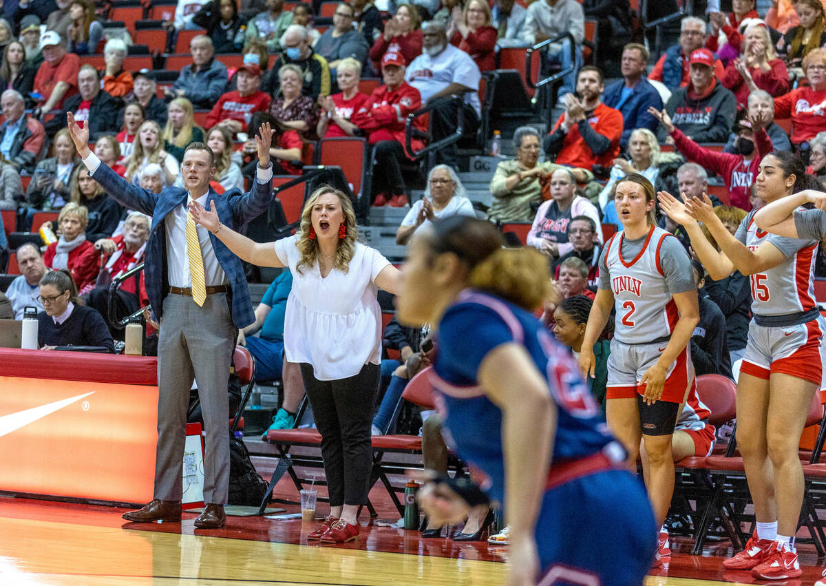 UNLV Lady Rebels head coach Lindy La Rocque, center left, with associate head coach Roman Owen, ...