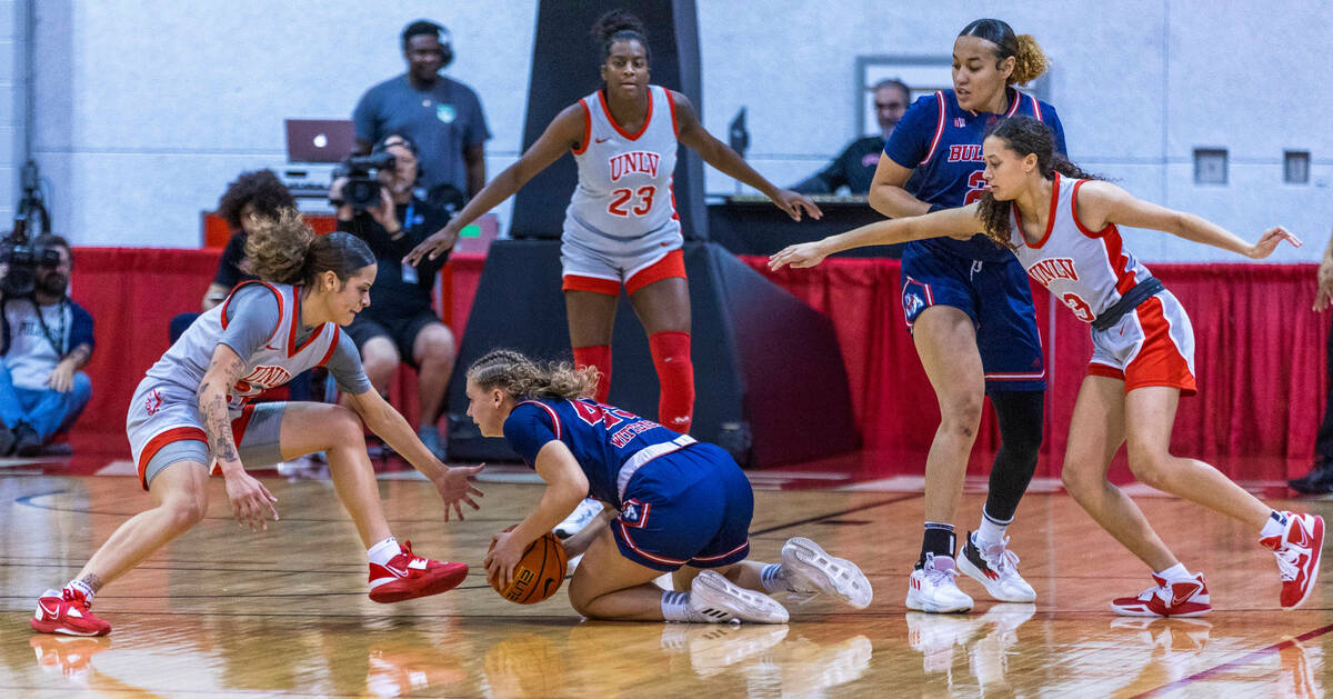 Fresno State Bulldogs guard Franka Wittenberg (45) is swarmed by UNLV Lady Rebels guard Essence ...