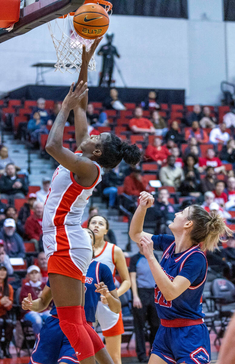 UNLV Lady Rebels center Desi-Rae Young (23) gets off a lay up over Fresno State Bulldogs guard ...