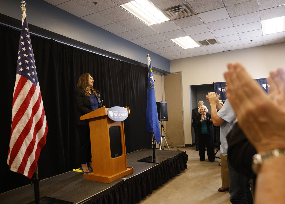 Attendees clap hands as Las Vegas Councilwoman Victoria Seaman speaks during a news conference ...