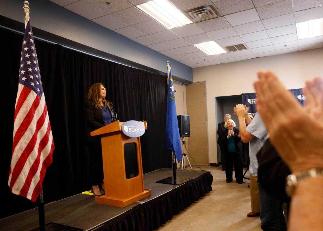 Attendees clap hands as Las Vegas Councilwoman Victoria Seaman speaks during a news conference ...
