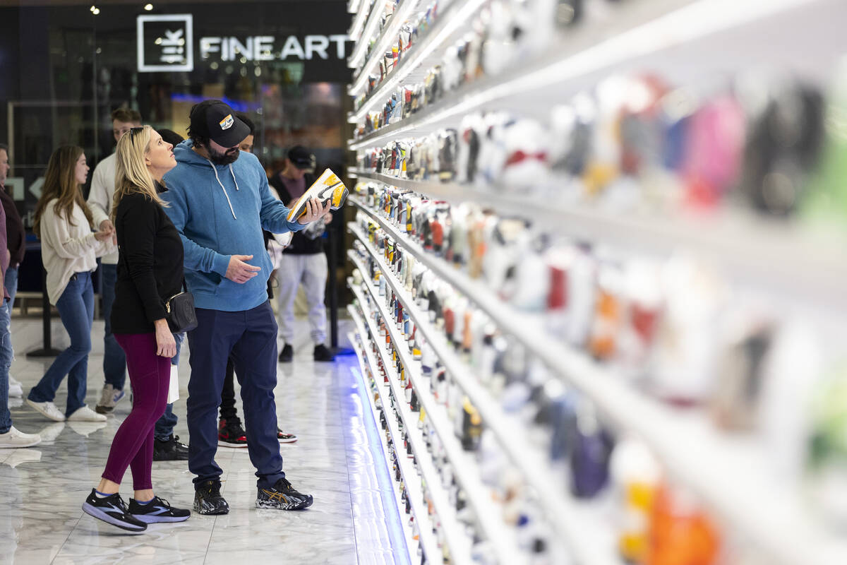People browse shoes at Urban Necessities inside of the Forum Shops at Caesars in Las Vegas, Fri ...