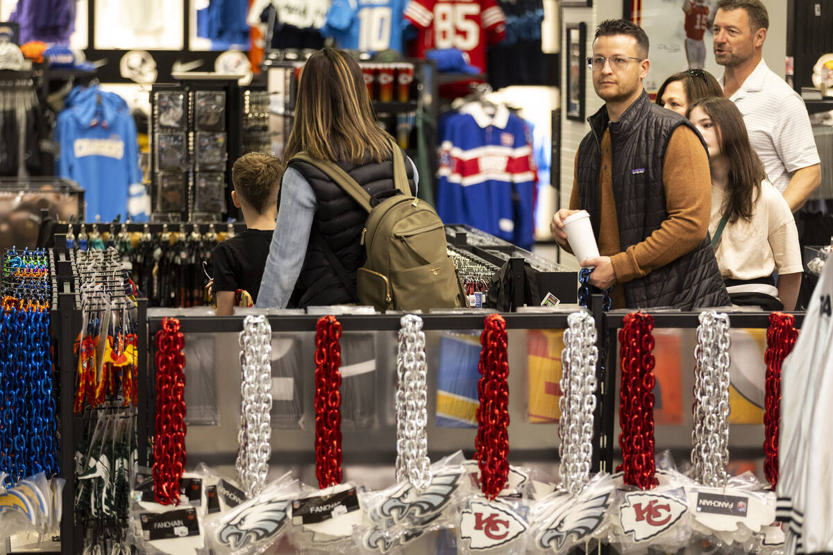 People browse the NFL Las Vegas Store inside of the Forum Shops at Caesars in Las Vegas, Friday ...