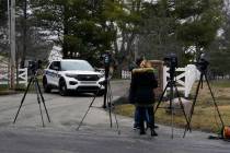 Police secure the entrance to the neighborhood of former Vice President Mike Pence's Indiana ho ...
