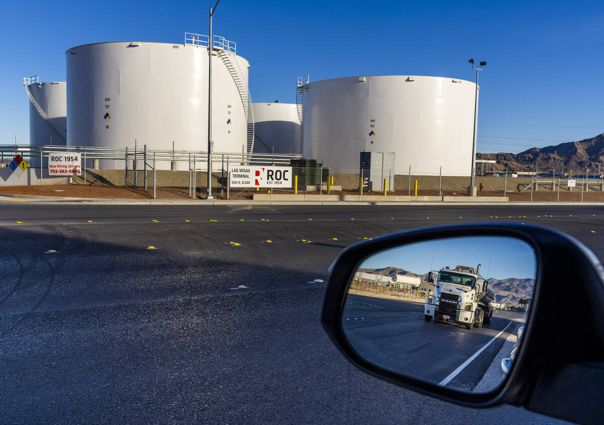 A tanker moves up the road across from the Rebel Oil Company facility outside of a fueling comp ...