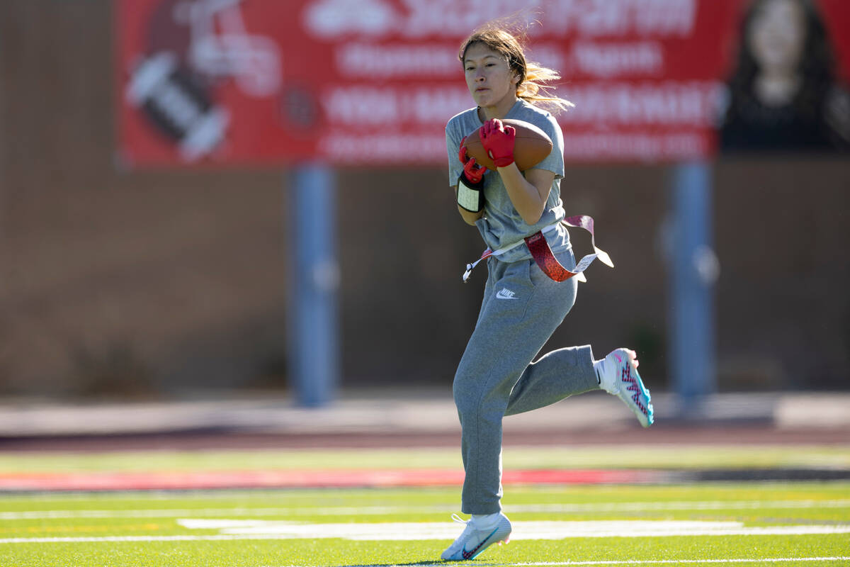 Erica Moreno makes a catch during a flag football practice at Desert Oasis High School in Las V ...