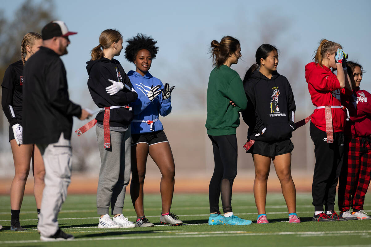 Players participate during a flag football practice at Desert Oasis High School in Las Vegas, T ...
