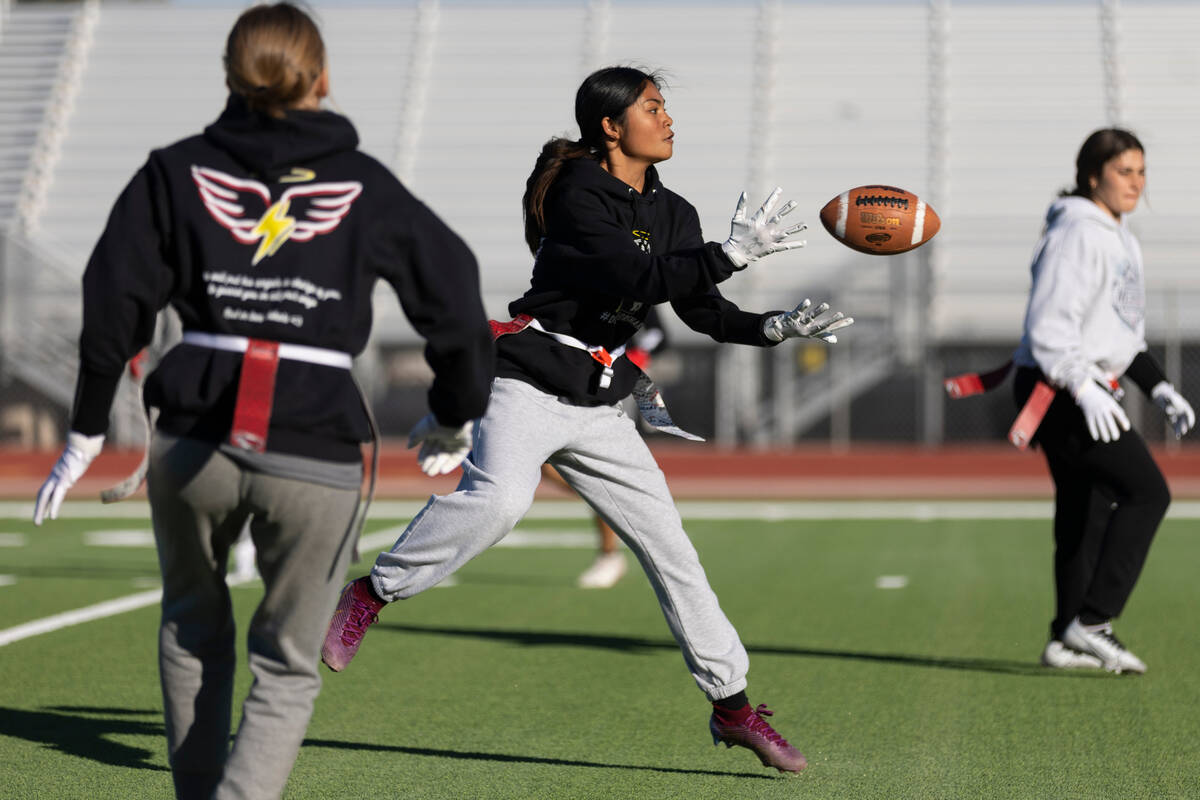 Allie Peralta makes a catch during a flag football practice at Desert Oasis High School in Las ...