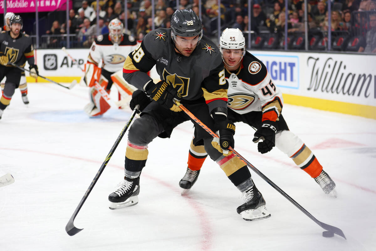 Vegas Golden Knights left wing William Carrier (28) fights for the puck against Anaheim Ducks d ...