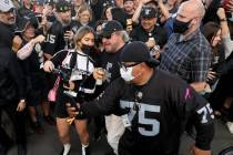 Sammy Hagar is surrounded by fans after performing during halftime as the Raiders take on the C ...