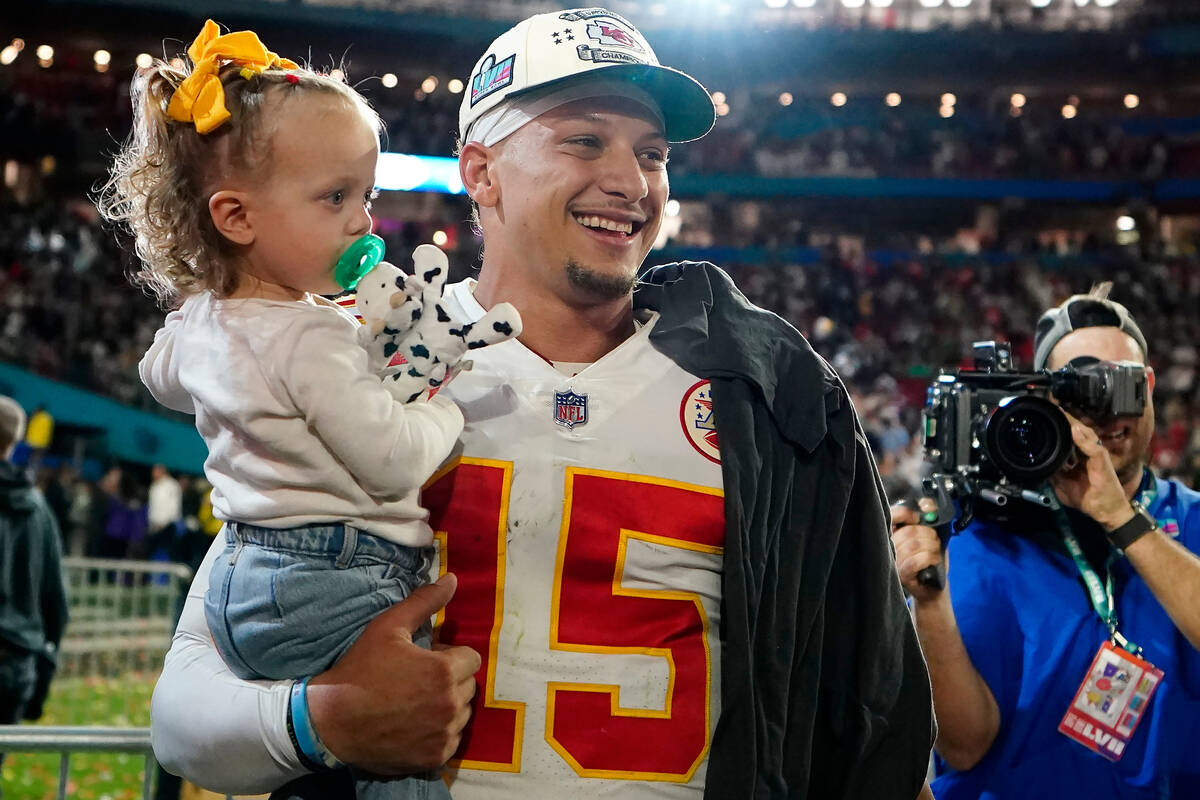 Kansas City Chiefs quarterback Patrick Mahomes holds his daughter, Sterling Skye Mahomes, after ...