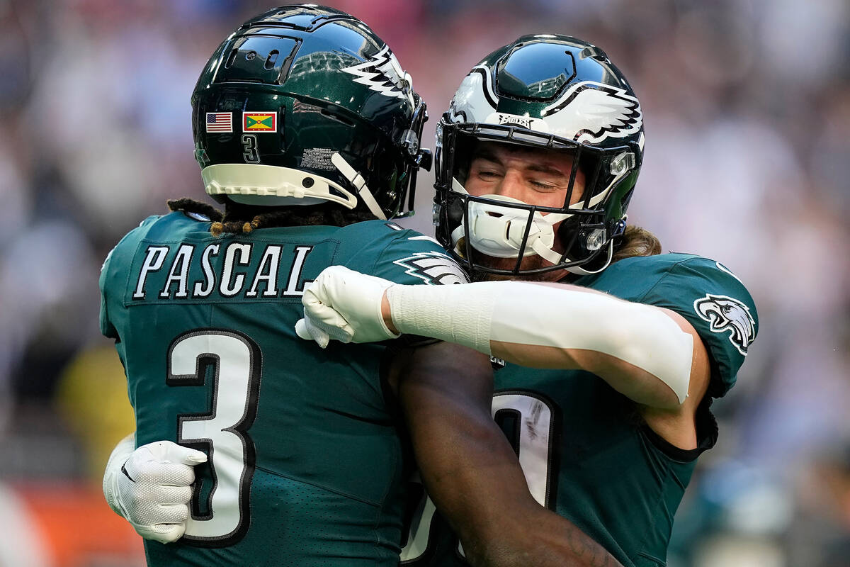 Philadelphia Eagles wide receiver Zach Pascal (3) embraces tight end Jack Stoll before the NFL ...