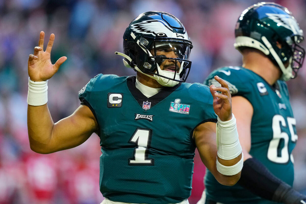 Philadelphia Eagles quarterback Jalen Hurts (1) celebrates after scoring a touchdown during the ...