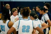 Centennial High School girls basketball coach Karen Weitz talks to her players during a girls h ...