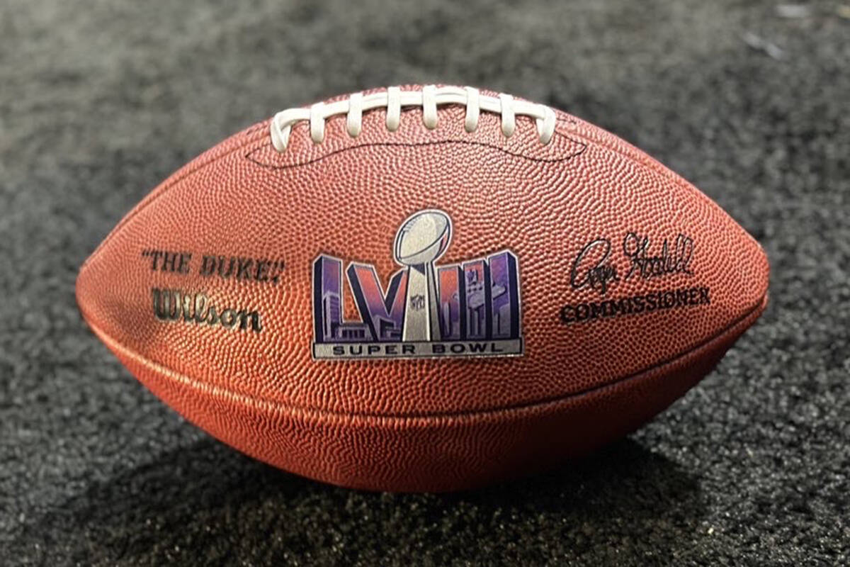 The first Super Bowl LVIII football displayed at the Phoenix Convention Center Feb. 13, 2023. ( ...