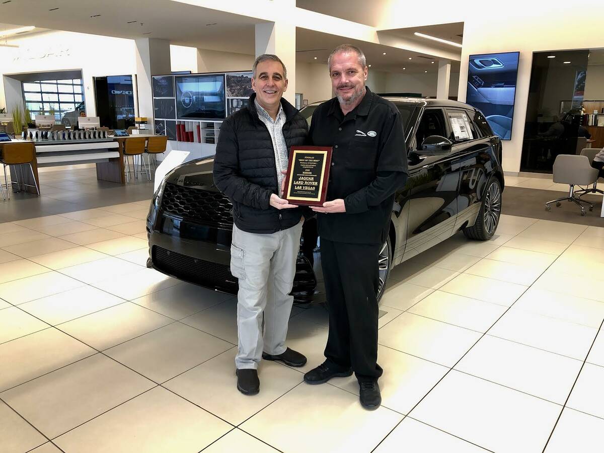 Jon Hewitt, parts manager for Jaguar Land Rover Las Vegas, and Brian Burroughs, national servic ...