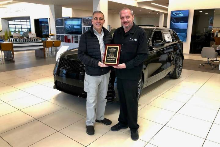 Jon Hewitt, parts manager for Jaguar Land Rover Las Vegas, and Brian Burroughs, national servic ...