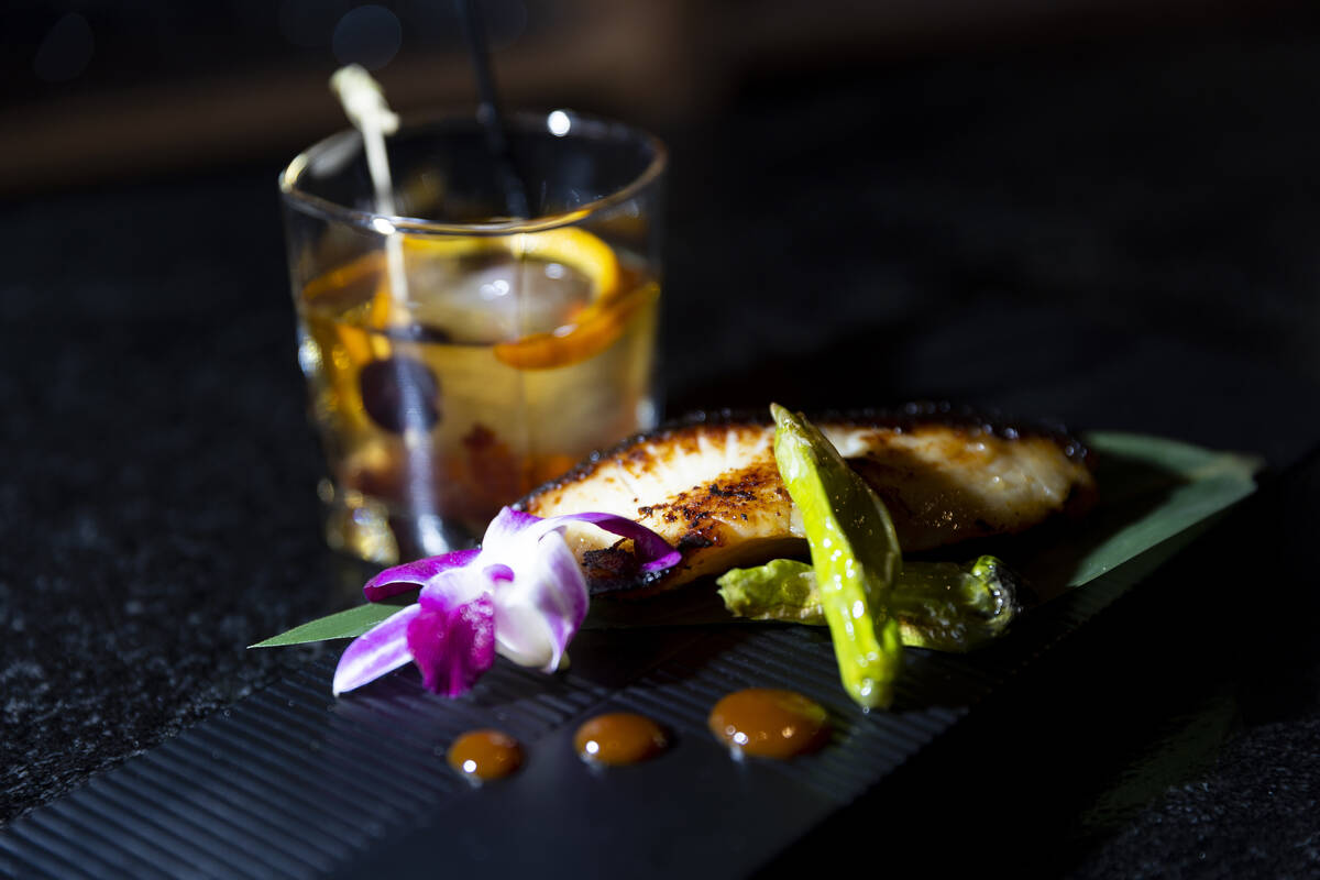 A miso black cod is seen served with shishito peppers at Maxan Jazz in Las Vegas, Saturday, Feb ...