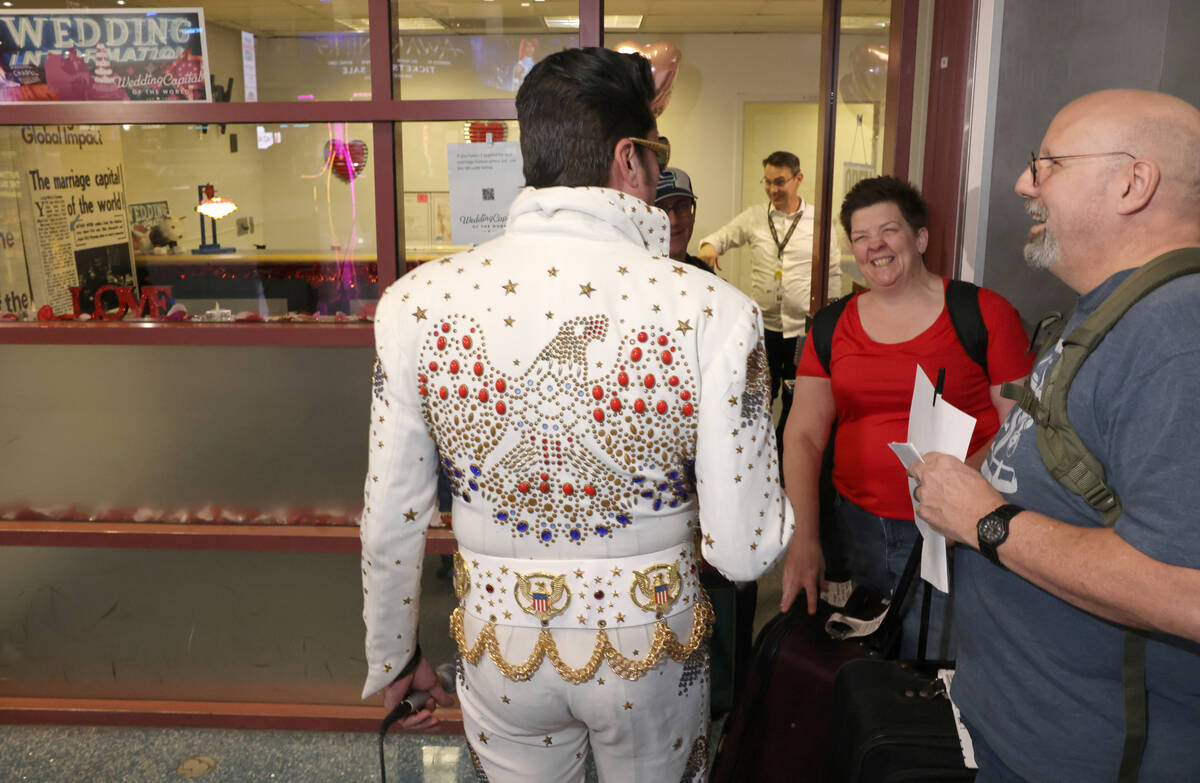 Brian Mills as Elvis sings visit with Glenn and Denise Peterson of Middlesex, N.J. at Harry Rei ...