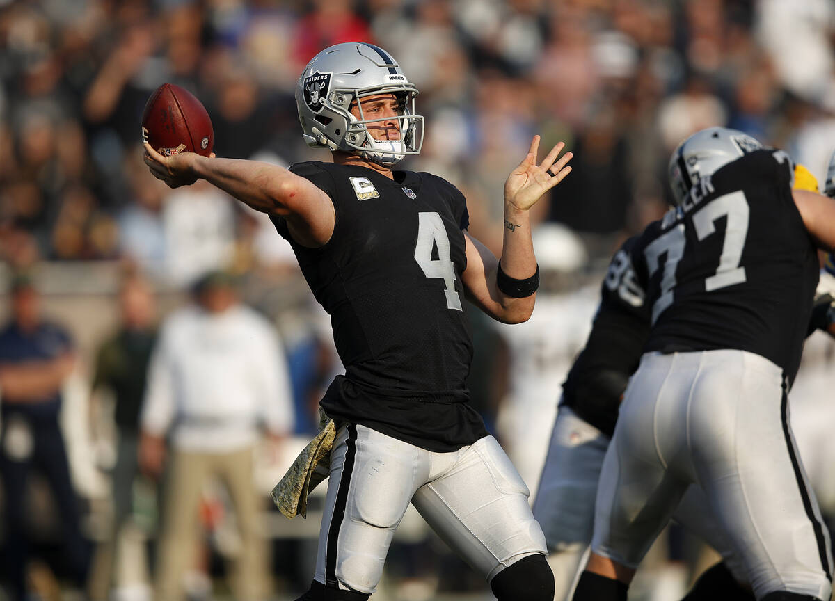 Oakland Raiders quarterback Derek Carr (4) against the Los Angeles Chargers during an NFL footb ...