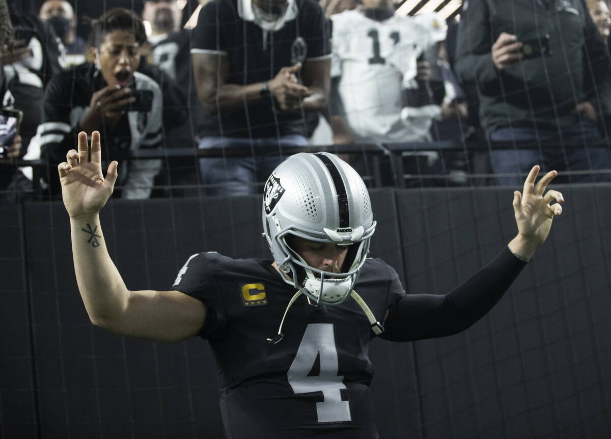 Raiders quarterback Derek Carr (4) is introduced before the start of an NFL football game again ...