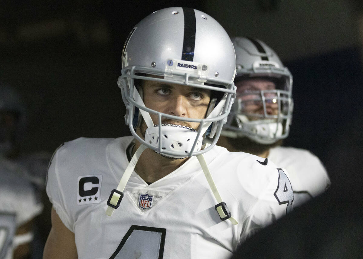 Raiders quarterback Derek Carr (4) prepares to take the field before an NFL game against the Lo ...
