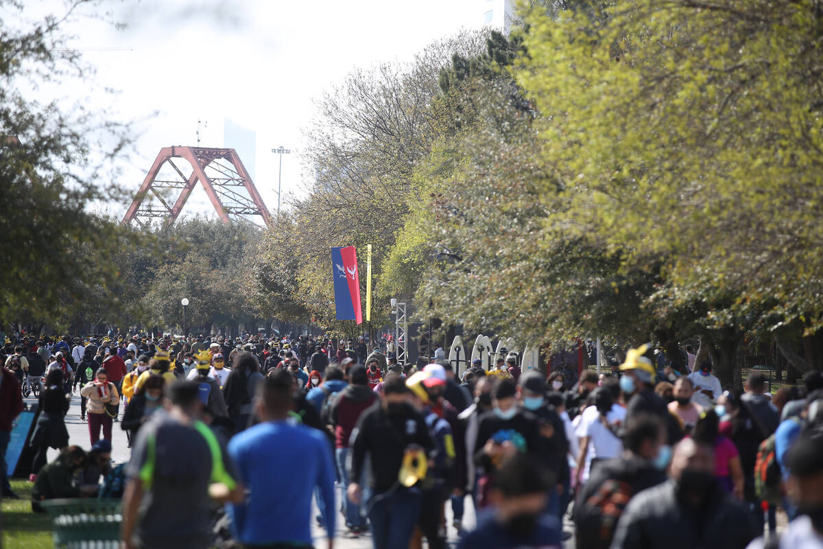 Attendees stroll through Parque Fundidora during a "Pokémon Go Tour" stop in February 2022 in ...
