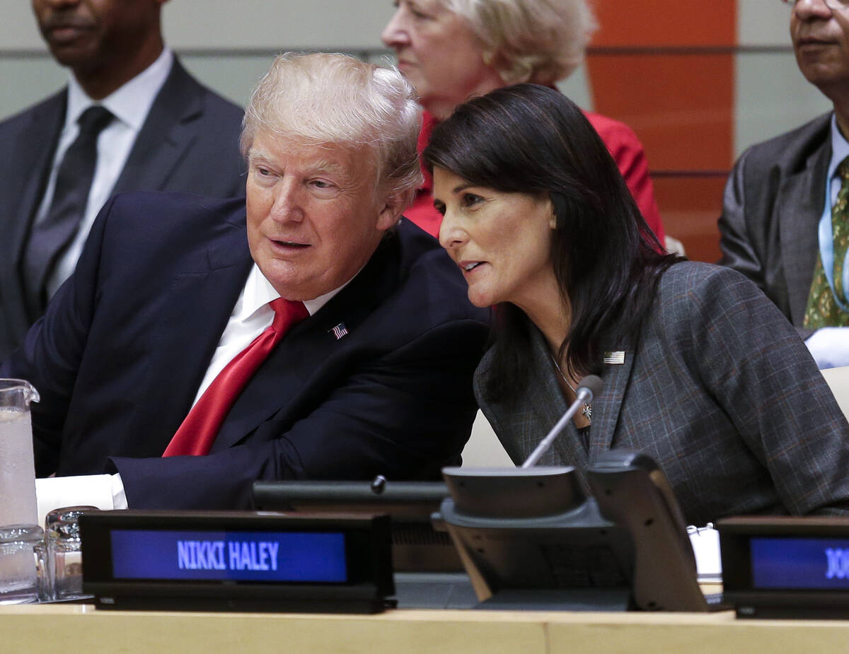 FILE - President Donald Trump speaks with U.S. Ambassador to the United Nations Nikki Haley bef ...