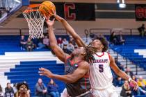 Arbor View's Brian Townsend (3) has a lay up rejected by Coronado's Lantz Stephenson (5) during ...